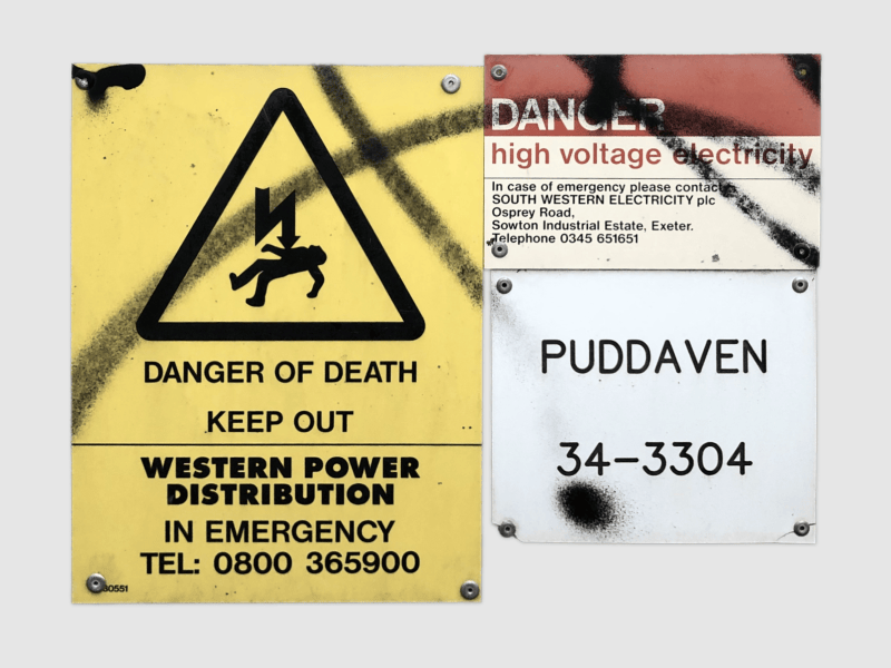 A group of warning signs using various sans-serif typefaces