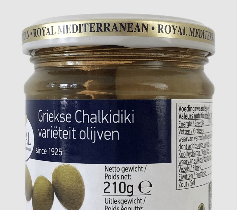 A closeup of the label on a jar of olives